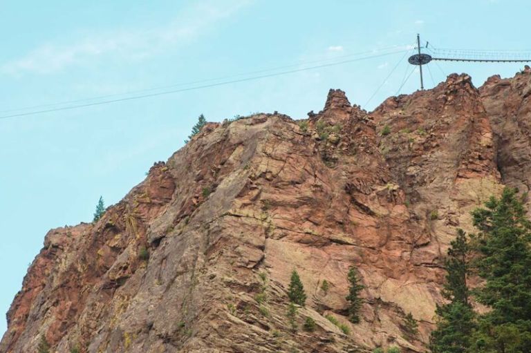 A Rocky Mountain With Trees