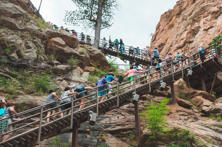 A Group Of People Climbing A Mountain