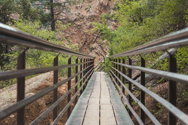 A Wooden Bridge Over A River