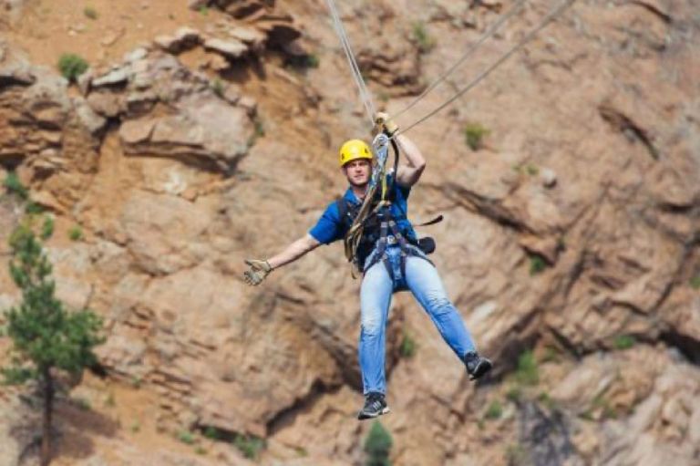A Person Climbing A Rock Wall