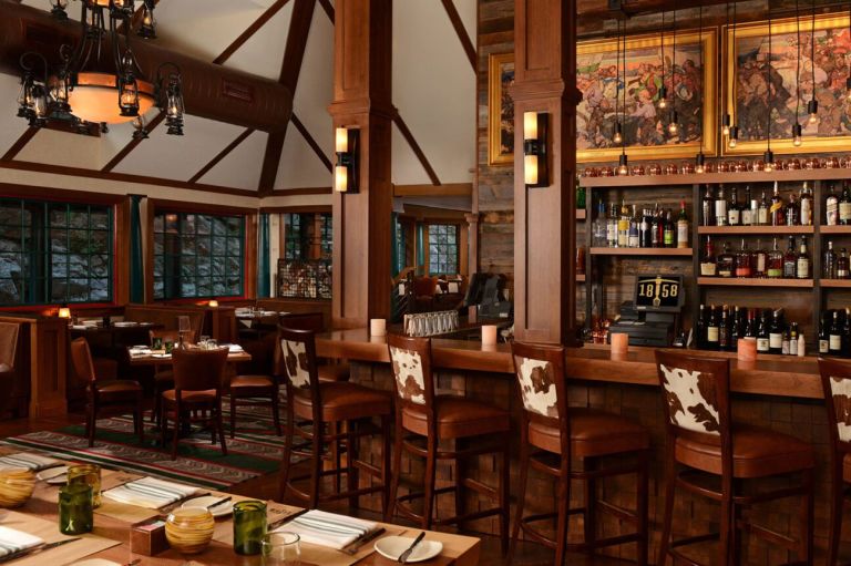 A Bar With Tables And Chairs