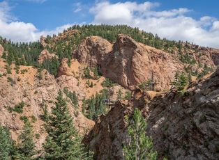 A Rocky Mountain With Trees