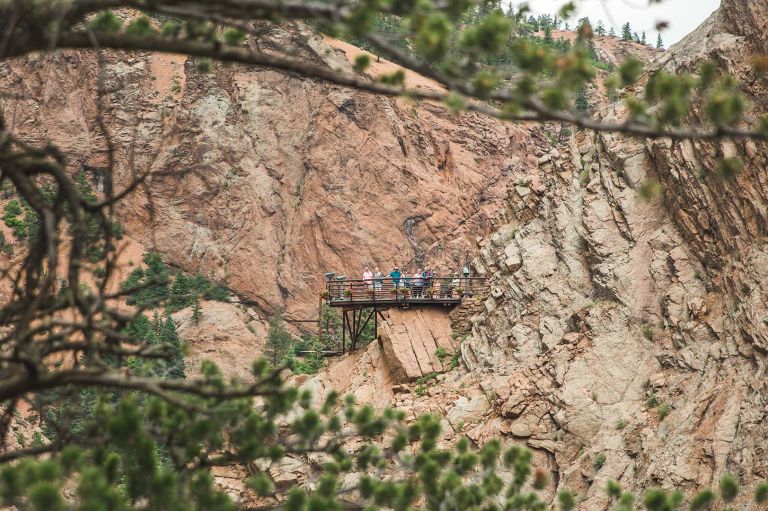 A Group Of People On A Bridge